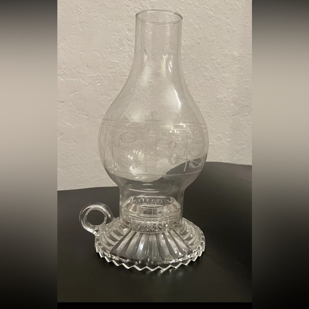 Pair of glass taper candle holders with etched hurricane top.